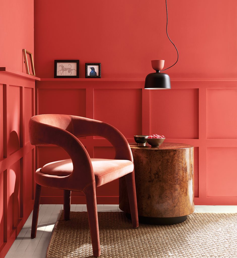 Armchair and side table in brightly painted room