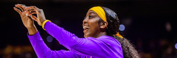 female college basketball player shooting a basket