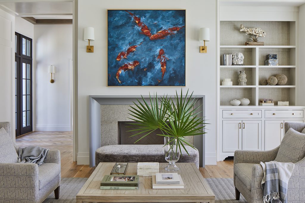 painting of coy fish hanging above fire place