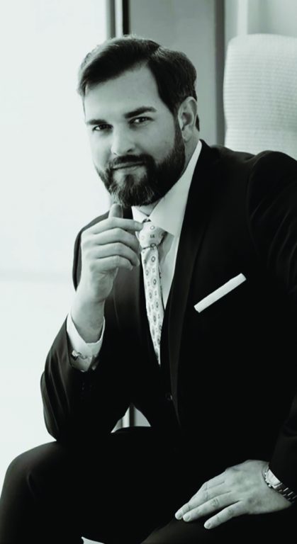 bearded man in a suit