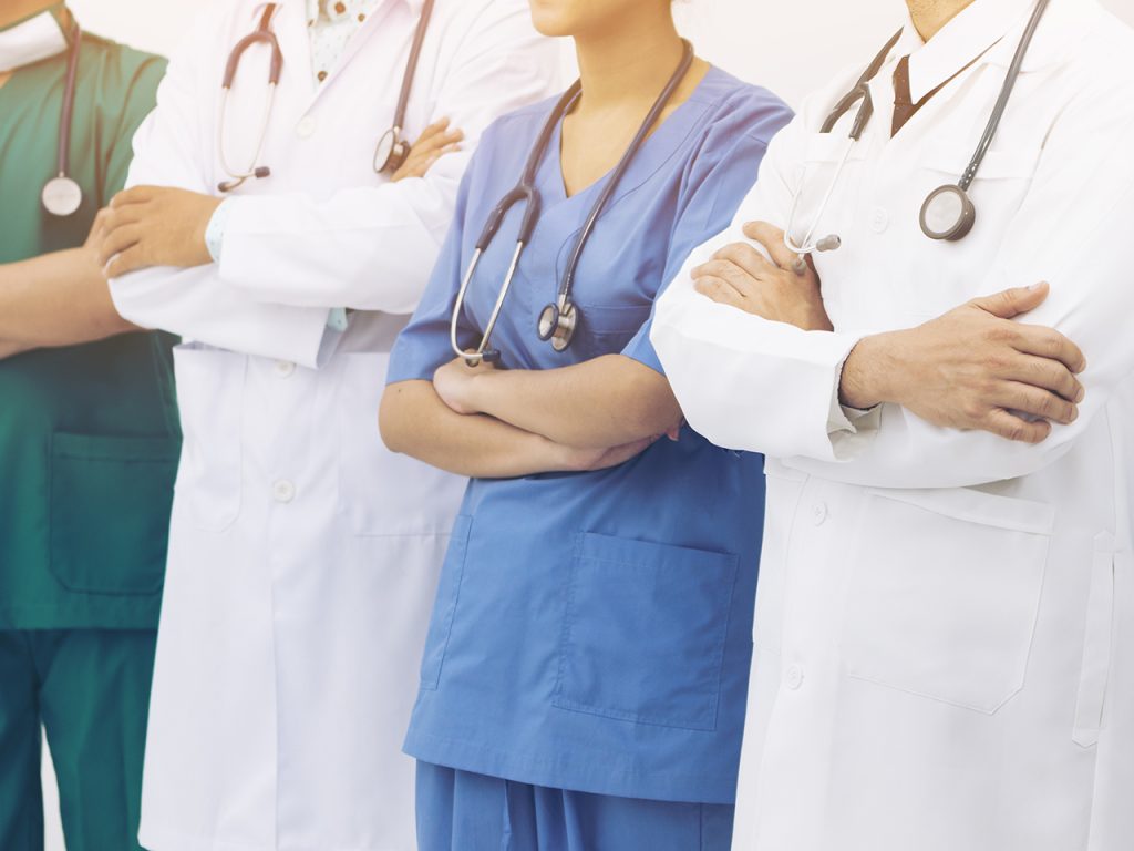 Doctors and nurses standing together