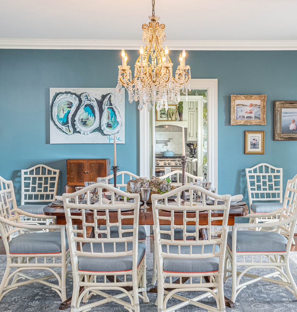 Dining room with blue walls and Swarovski crystal chandelier