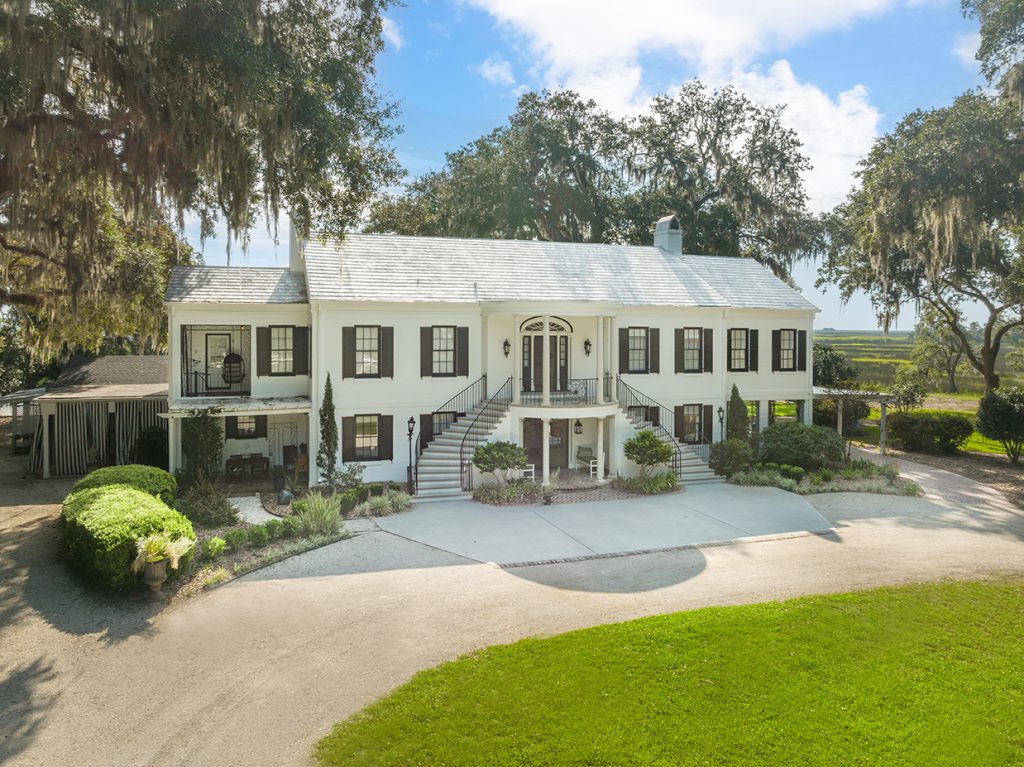 White mansion with black shutters