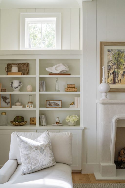 Built-in bookshelves next to a fireplace