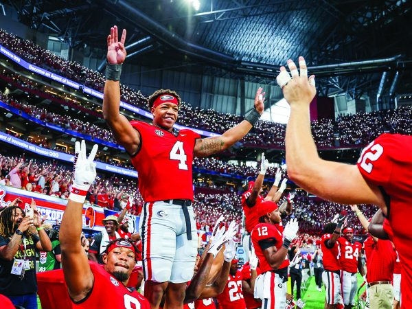 Football player Nolan Smith celebrating a victory