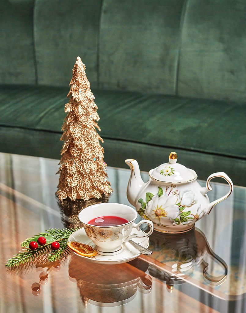 Tea pot and cup on glass top table