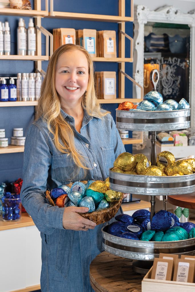 Woman holding fancy soaps in a basket