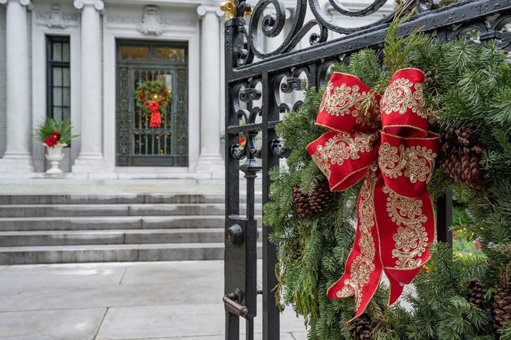 Holiday wreaths on the Kessler Mansion gates