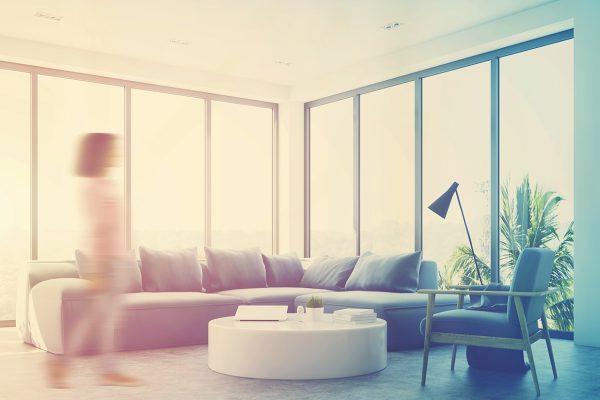 White living room interior with a blue sofa, an armchair and a small round table. Panoramic windows. Woman, corner. 3d rendering mock up toned image