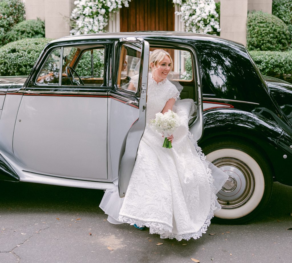 bride getting out of a classic car